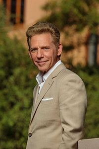 David Miscavige in Johannesburg, South Africa, close-up, wearing tan suit