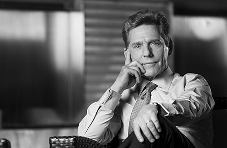 David Miscavige, close-up, black and white, hand on chin