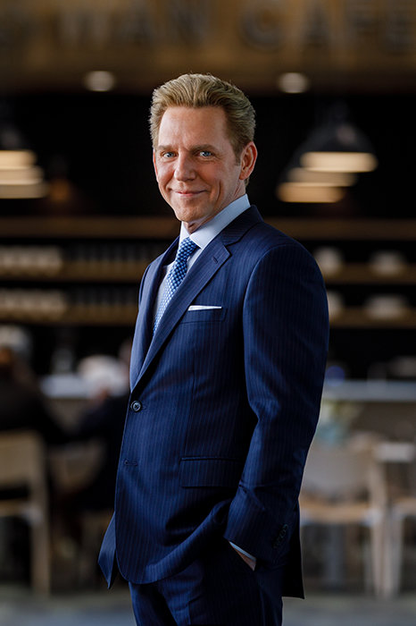 David Miscavige in Perth, Australia, wearing blue suit, hands in pockets