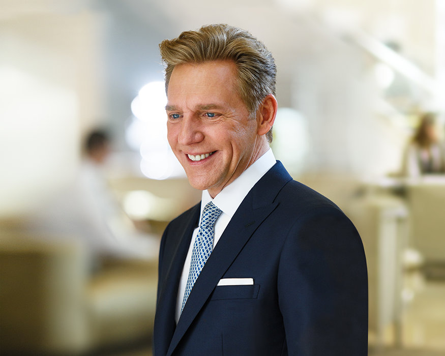 David Miscavige portrait in blue suit, smiling